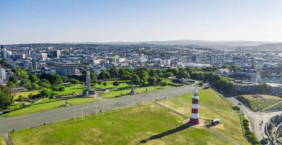 An aerial view of Plymouth, from the sea looking back towards the city centre, including Smeaton's Tower.